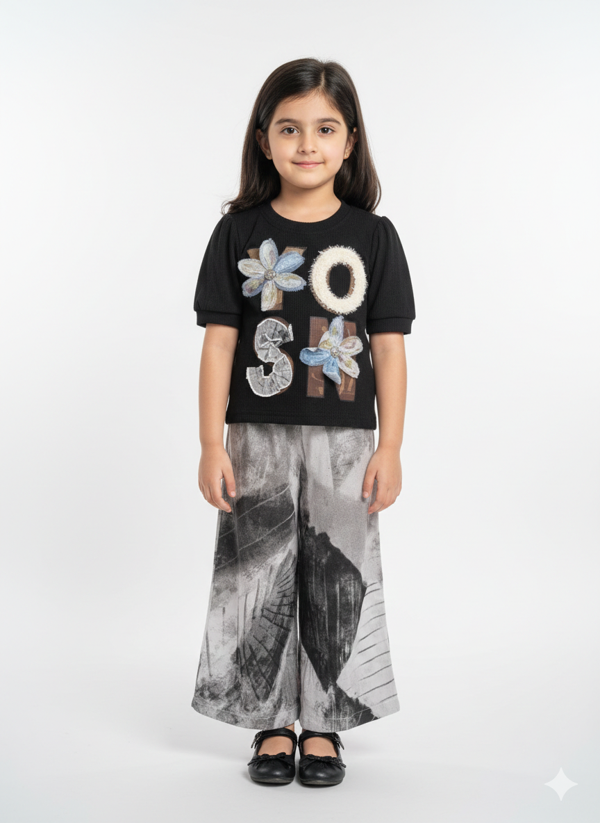 Stylish Girls Black Top And Printed Wide Leg Pants Set With Trendy Floral Appliqué