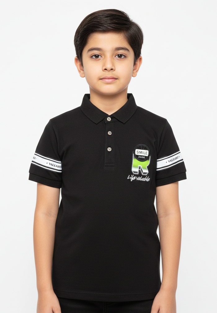 A Contemporary Portrait Featuring A Young Boy In A Soft Sage Green Graphic Polo
