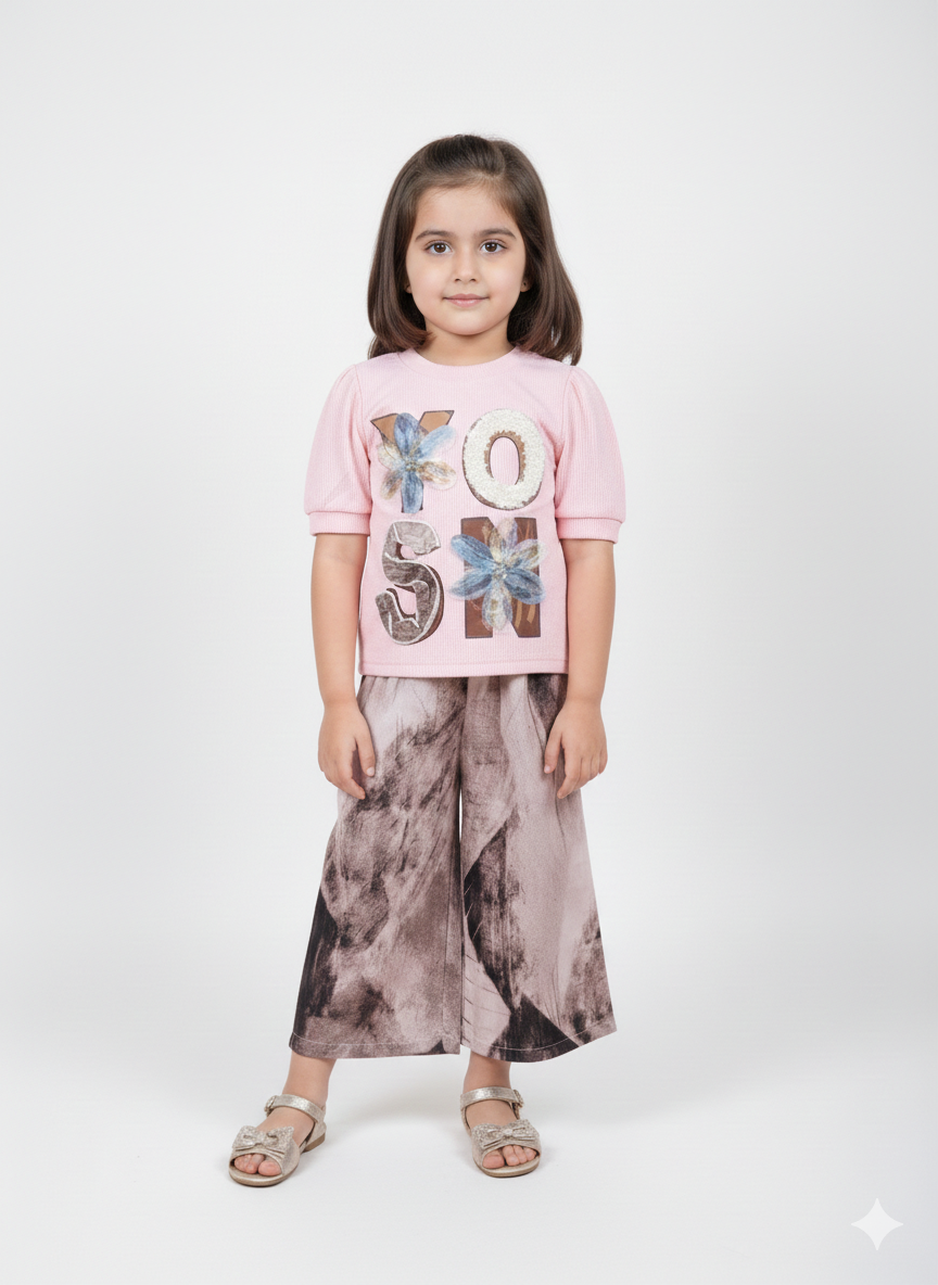 Stylish Girls Black Top And Printed Wide Leg Pants Set With Trendy Floral Appliqué
