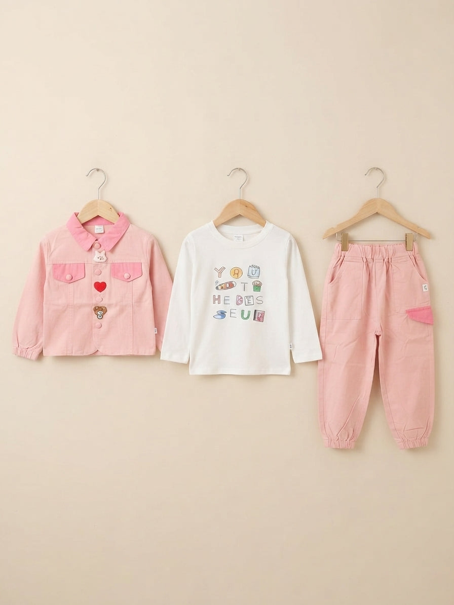 Charming pink three-piece outfit featuring a button jacket, cotton shirt, and comfy trousers.