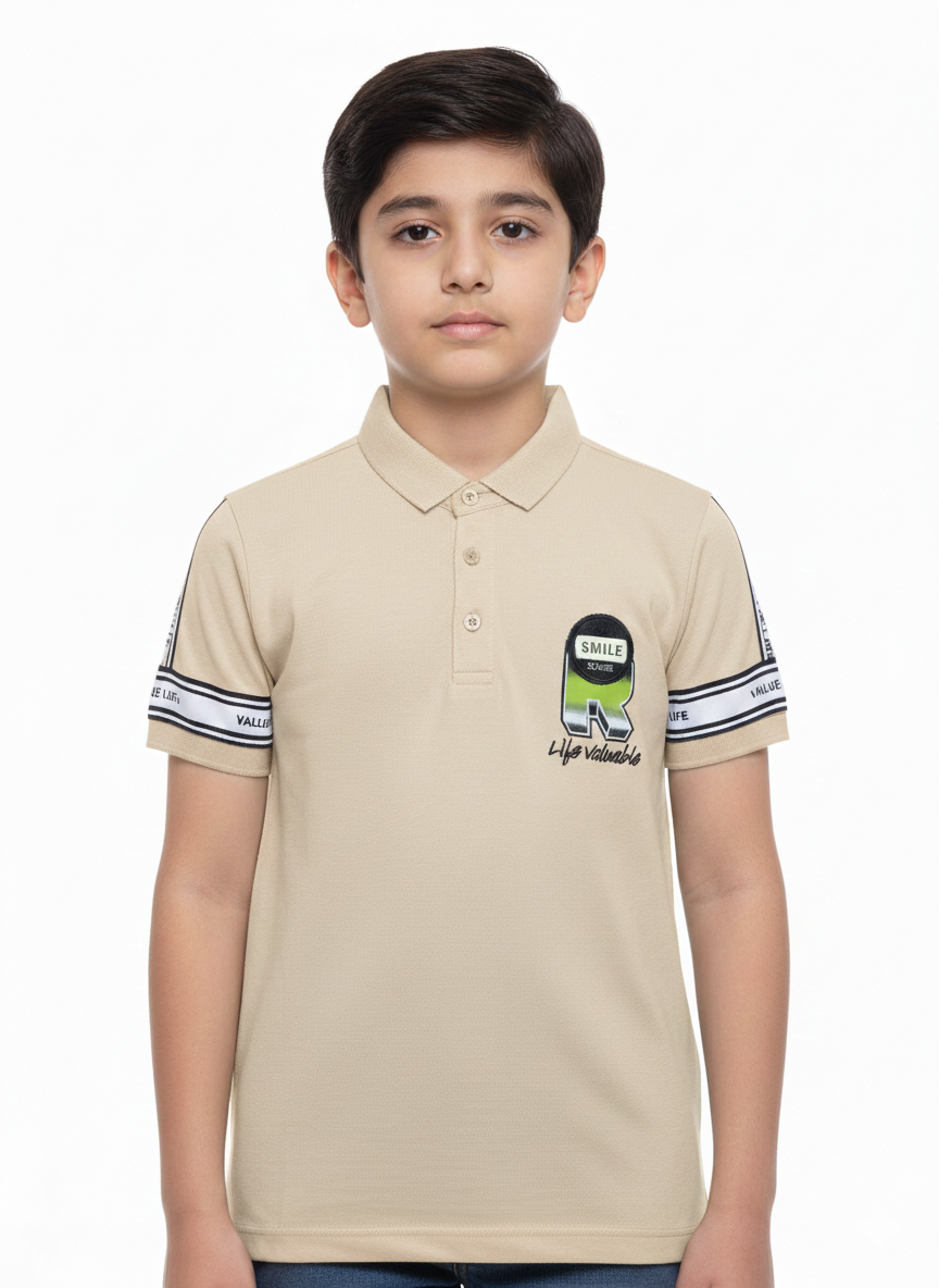 A Contemporary Portrait Featuring A Young Boy In A Soft Sage Green Graphic Polo