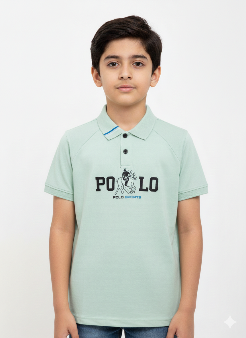 A Modern Portrait Of A Young Boy Wearing A Multicolored Sage Green Graphic Polo Shirt
