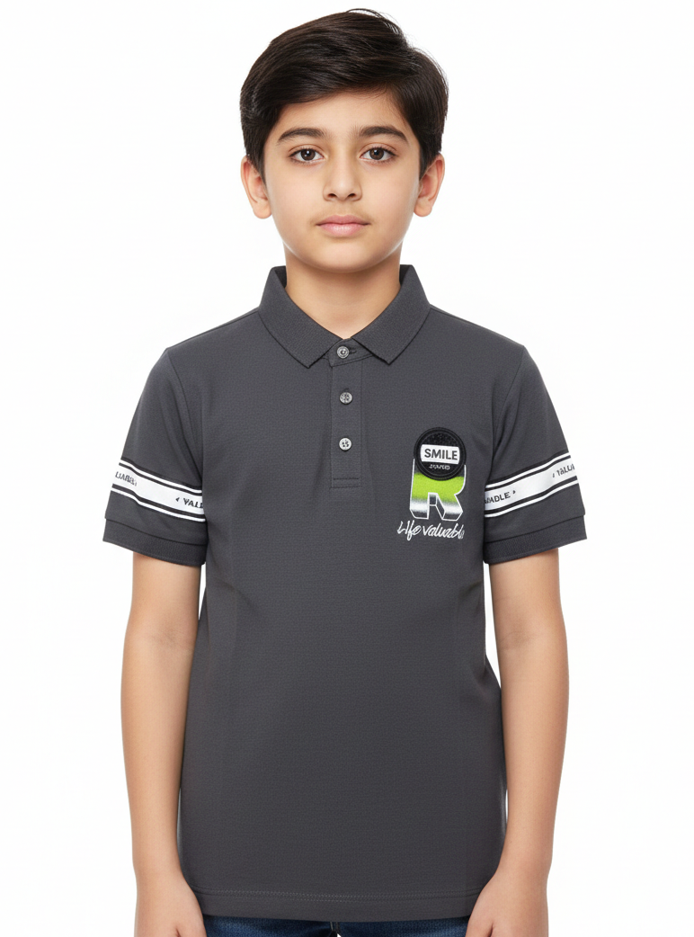 A Contemporary Portrait Featuring A Young Boy In A Soft Sage Green Graphic Polo